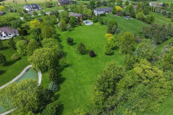 a view of a garden with a house