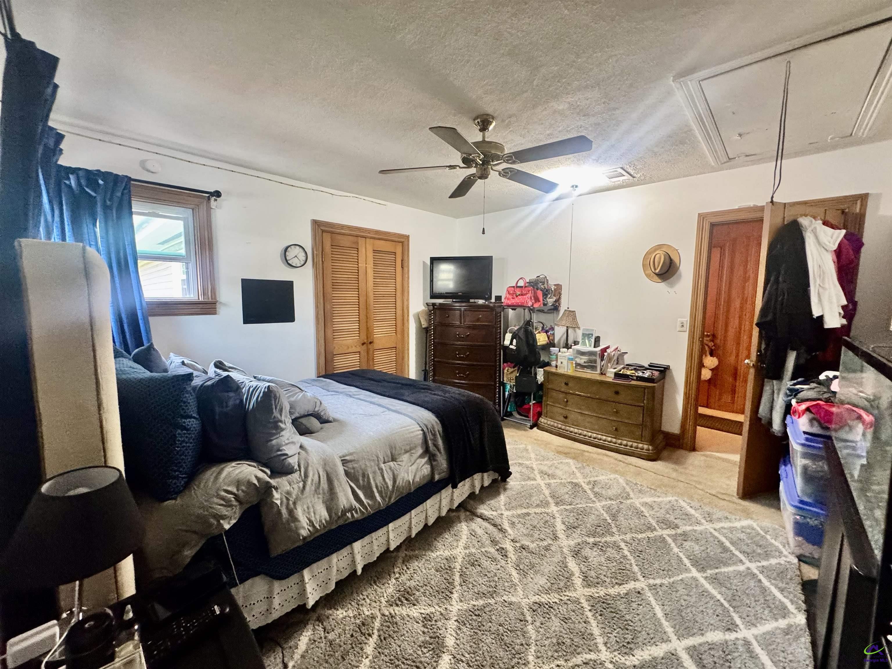 914 Adderton Street Americus, GA 31719 - Photo 22 of 53 a bed room with a bed and furniture