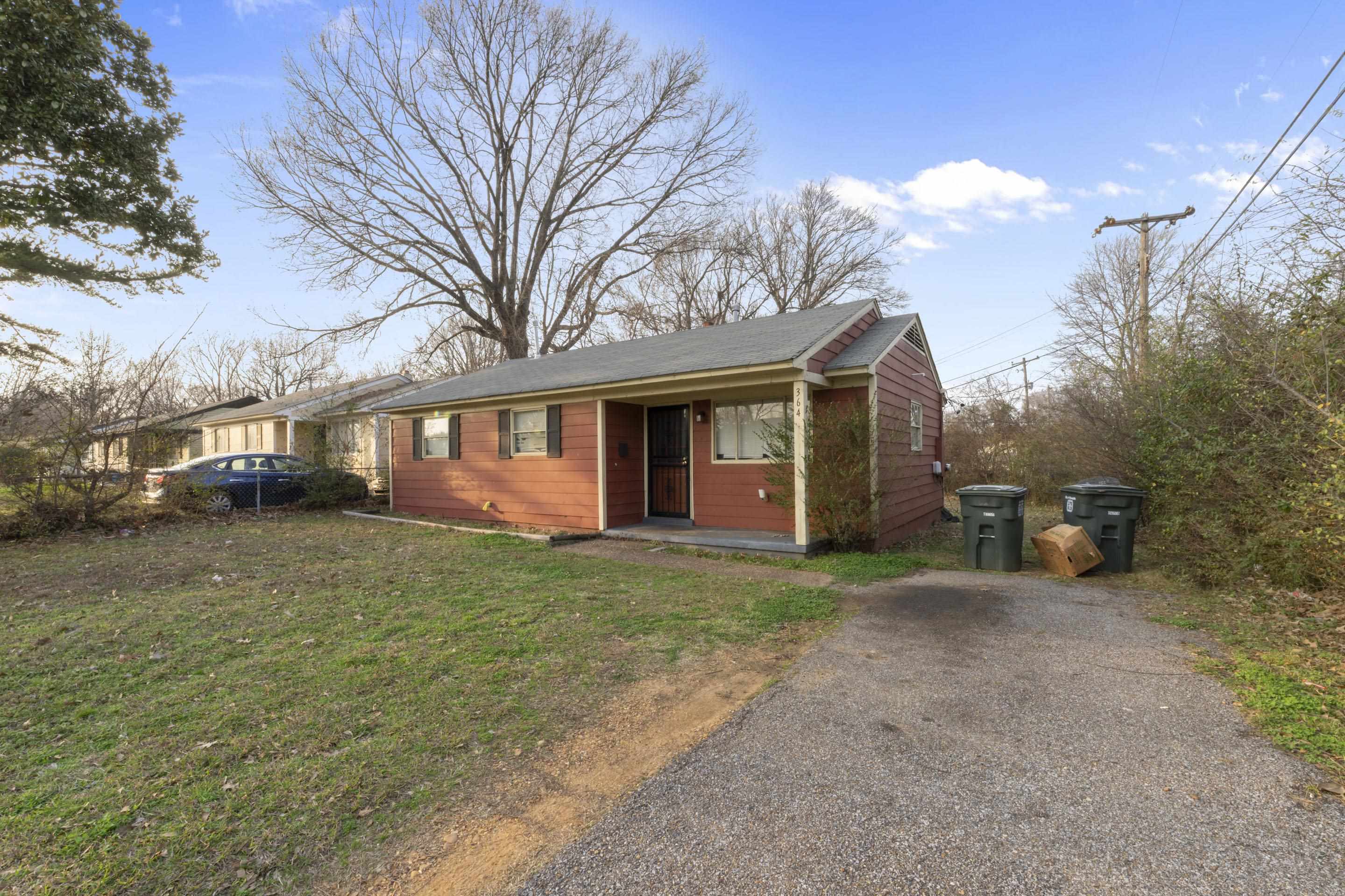 364 Elder Road Memphis, TN 38109 - Photo 2 of 11 a view of a house with a yard