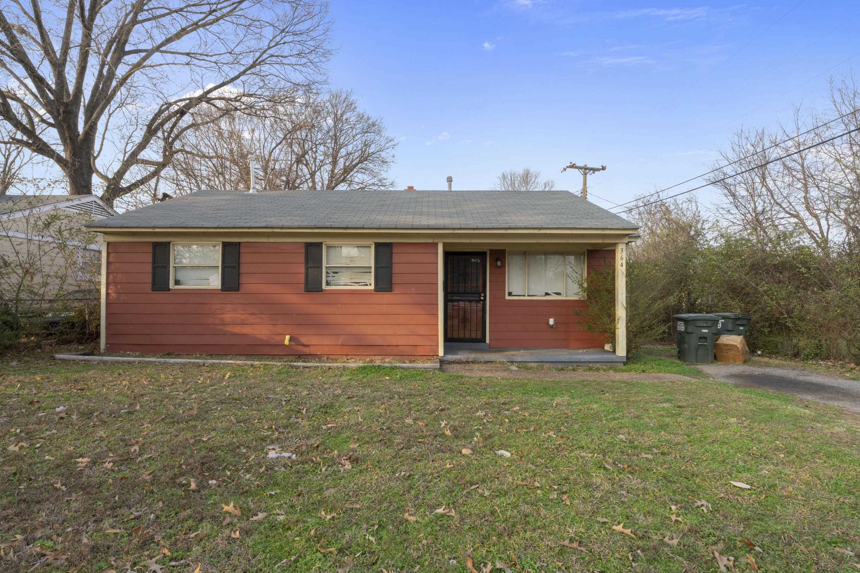 364 Elder Road Memphis, TN 38109 - Photo 3 of 11 a front view of a house with yard and trees