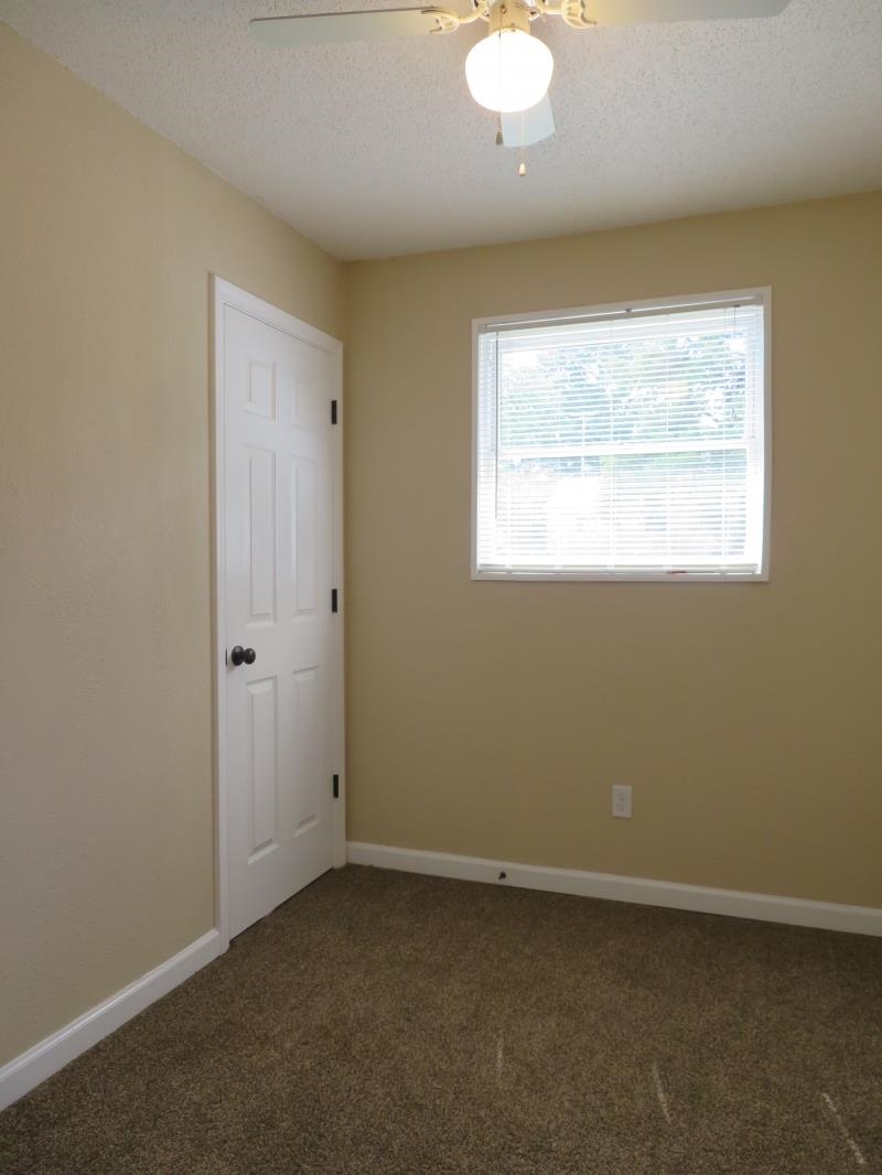 364 Elder Road Memphis, TN 38109 - Photo 9 of 11 an empty room with a window