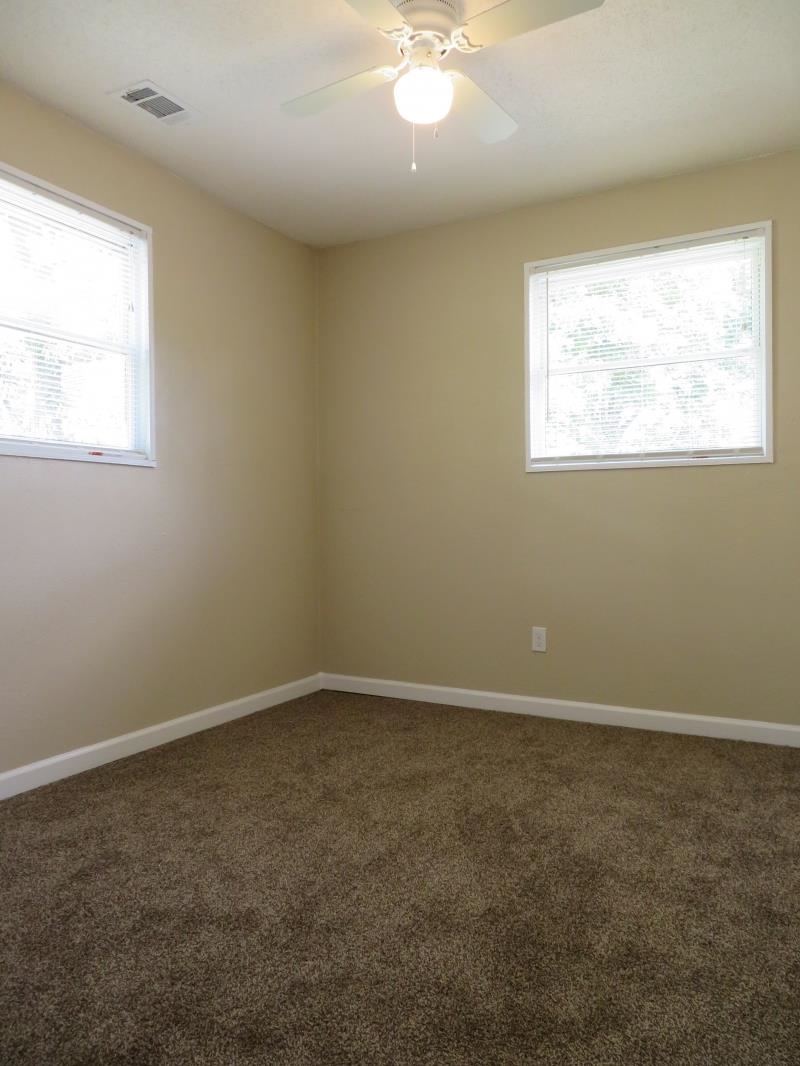 364 Elder Road Memphis, TN 38109 - Photo 10 of 11 an empty room with a window