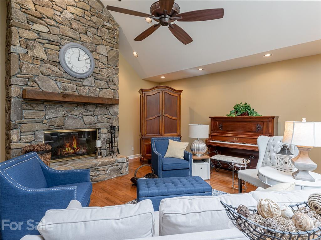 103 Windsong Drive Fairview, NC 28730 - Photo 12 of 36 a living room with furniture and a fireplace