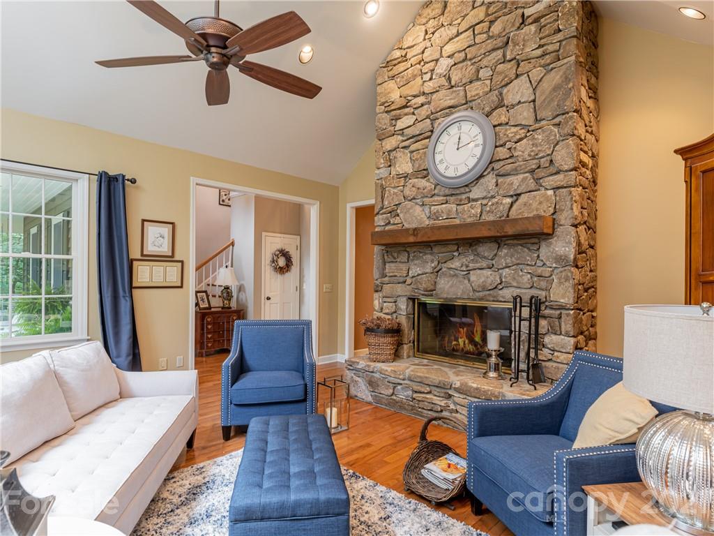103 Windsong Drive Fairview, NC 28730 - Photo 13 of 36 a living room with furniture and a fireplace