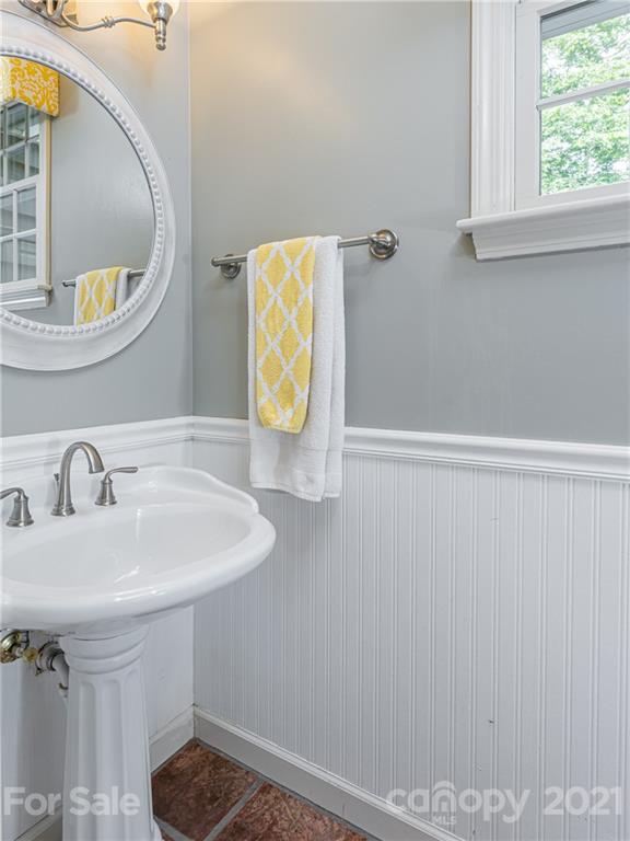103 Windsong Drive Fairview, NC 28730 - Photo 18 of 36 a bathroom with a sink and a mirror