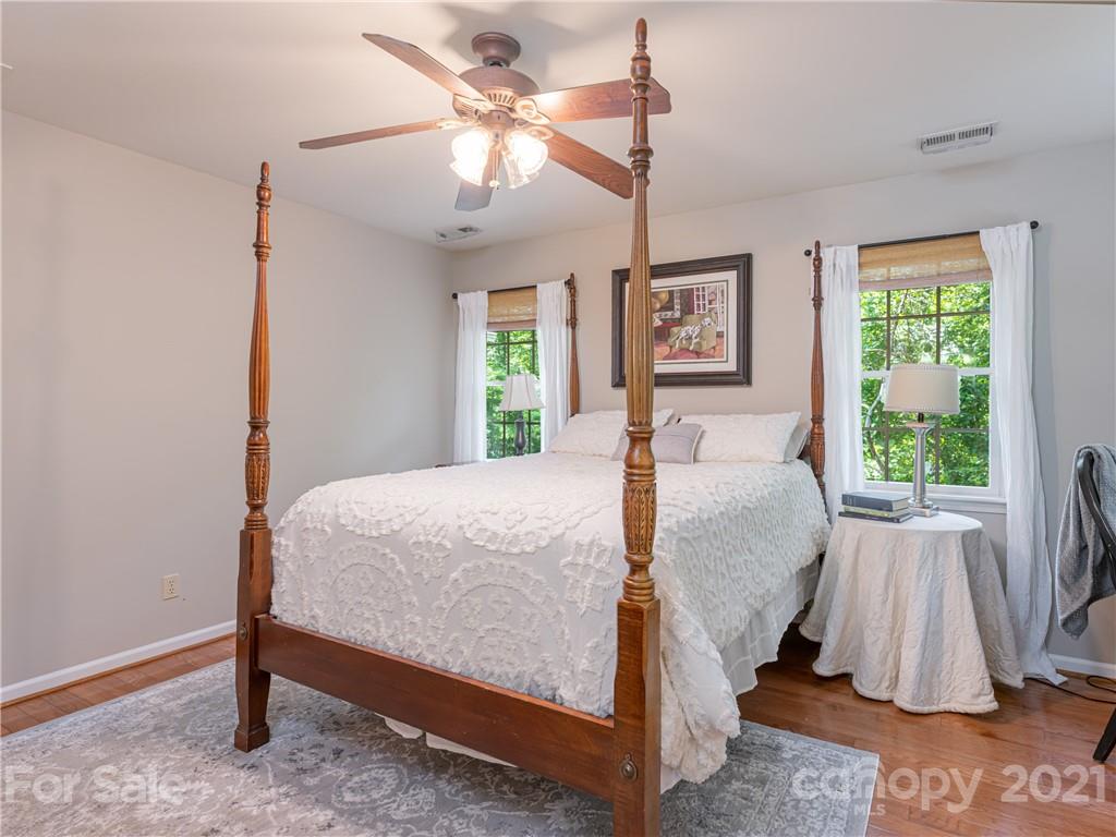 103 Windsong Drive Fairview, NC 28730 - Photo 24 of 36 a bed room with a bed and a window