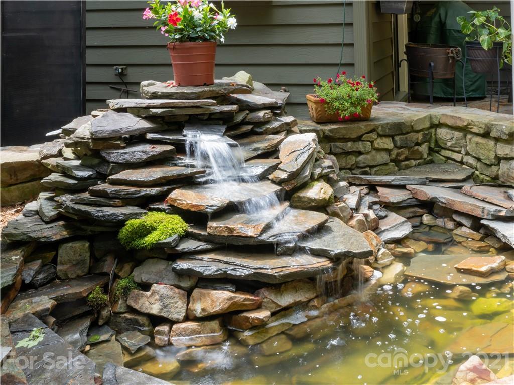 103 Windsong Drive Fairview, NC 28730 - Photo 29 of 36 a view of a backyard with chairs