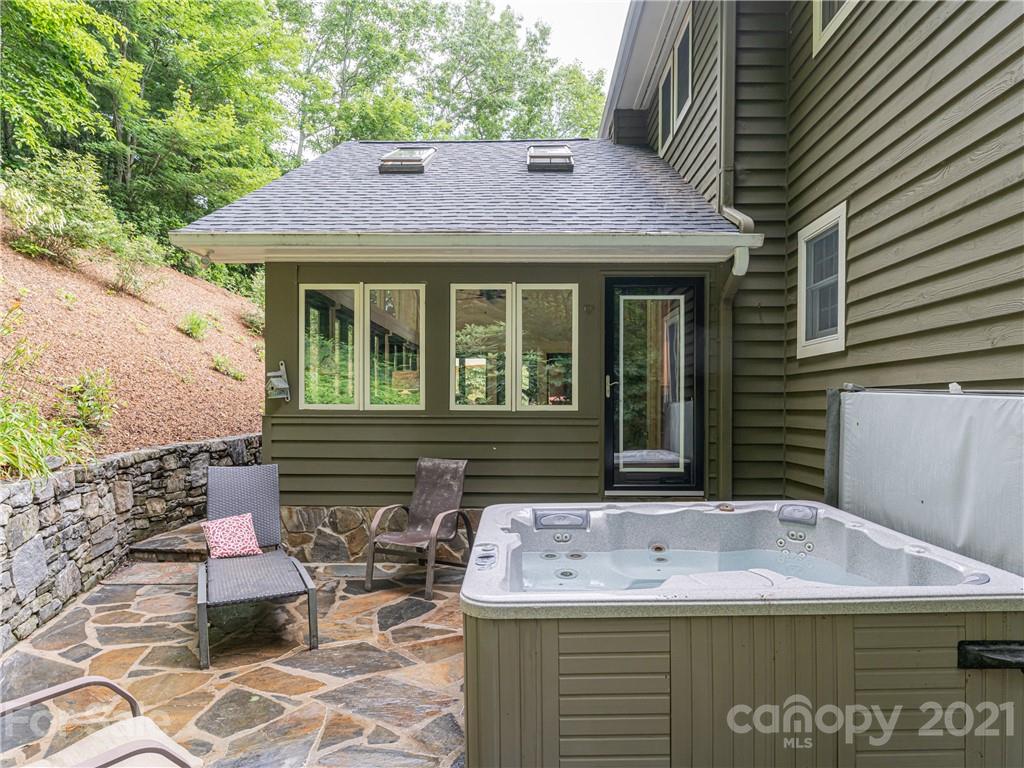 103 Windsong Drive Fairview, NC 28730 - Photo 33 of 36 a front view of a house with garden