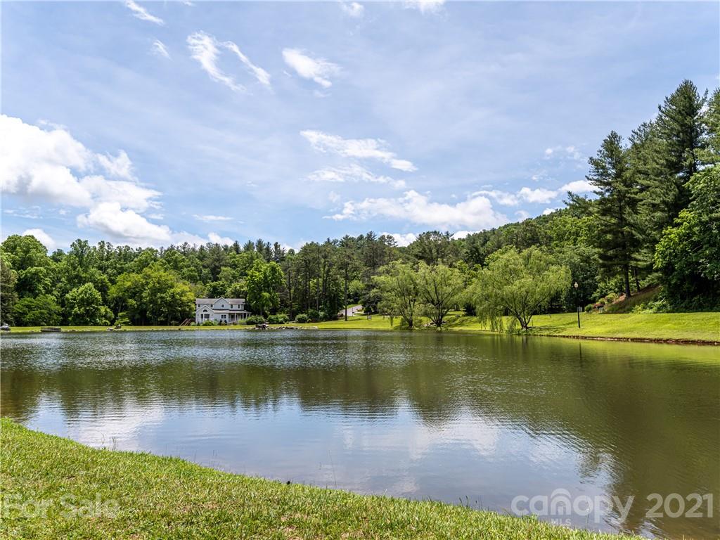 103 Windsong Drive Fairview, NC 28730 - Photo 36 of 36 a view of a lake in between the city and lake