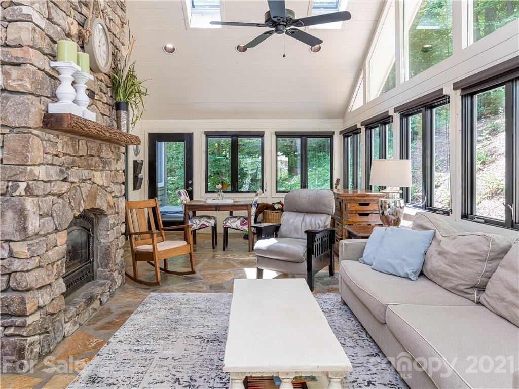 103 Windsong Drive Fairview, NC 28730 - Photo 5 of 36 a living room with furniture and a large window