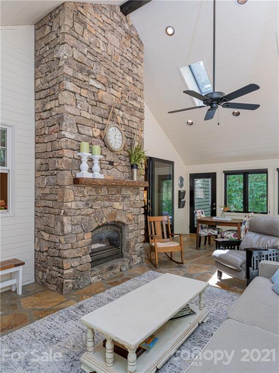 103 Windsong Drive Fairview, NC 28730 - Photo 6 of 36 a living room with furniture and a fireplace