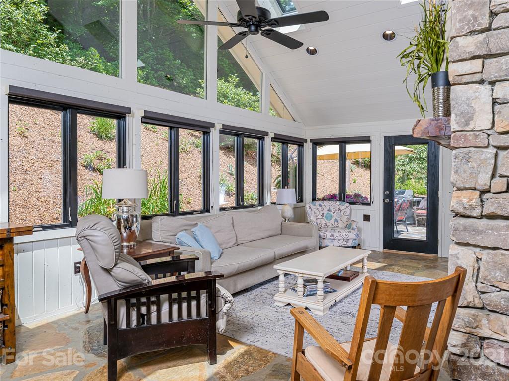 103 Windsong Drive Fairview, NC 28730 - Photo 7 of 36 a living room with furniture and a large window