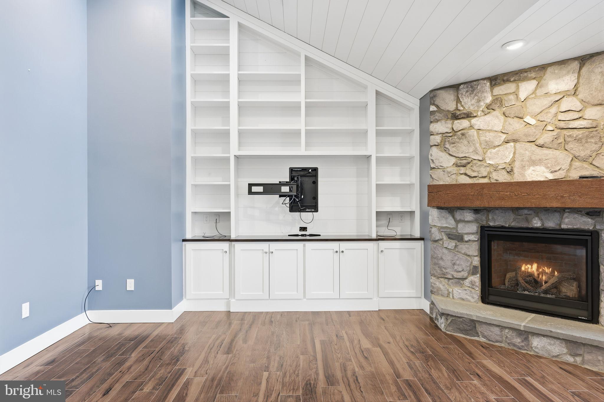 176 Fenstermaker Road Kutztown, PA 19530 - Photo 122 of 149 Modern living space with stone fireplace charm.