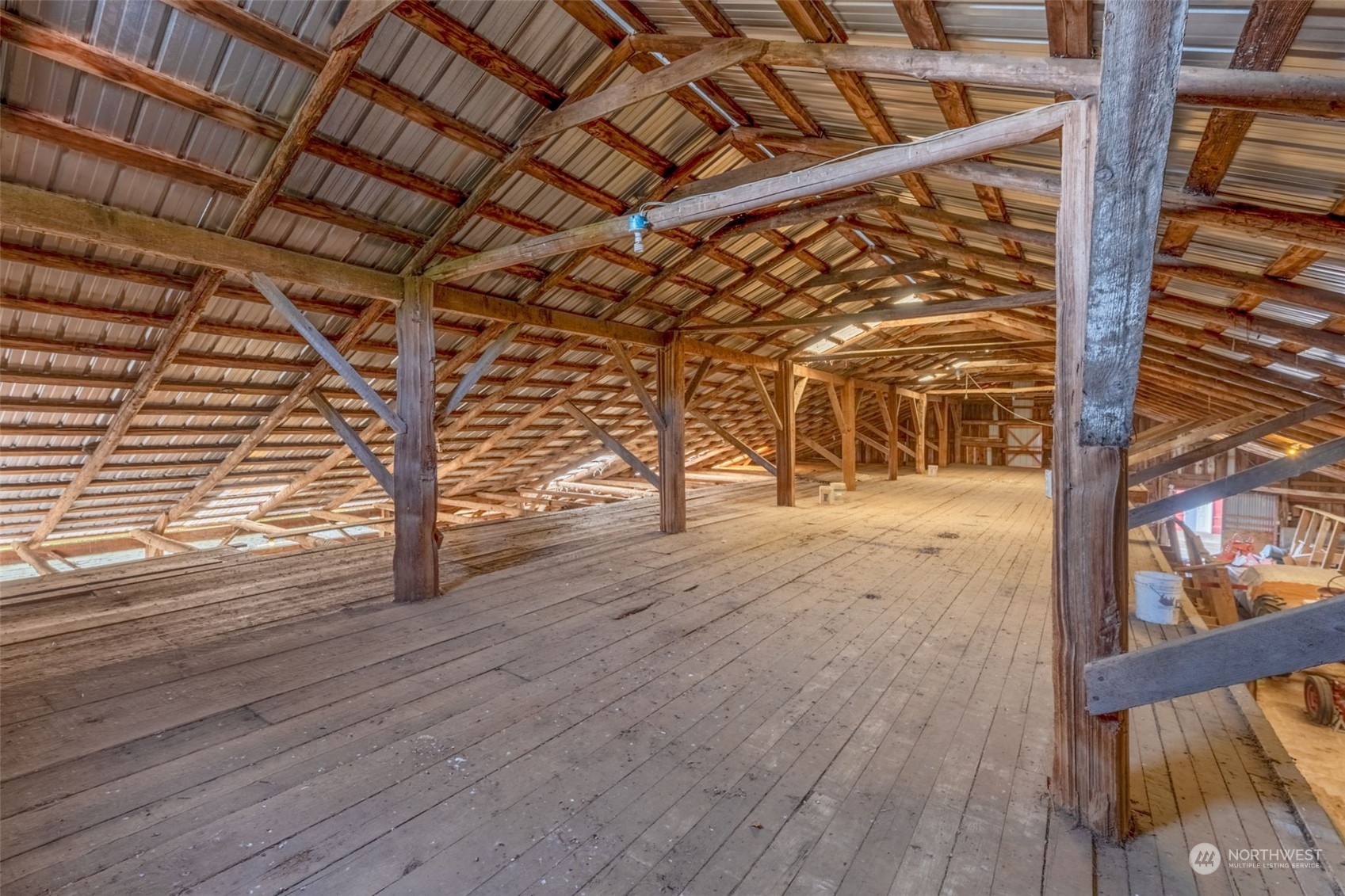 628 East Valley Road Skamokawa, WA 98647 - Photo 11 of 39 a view of an empty room with wooden floor