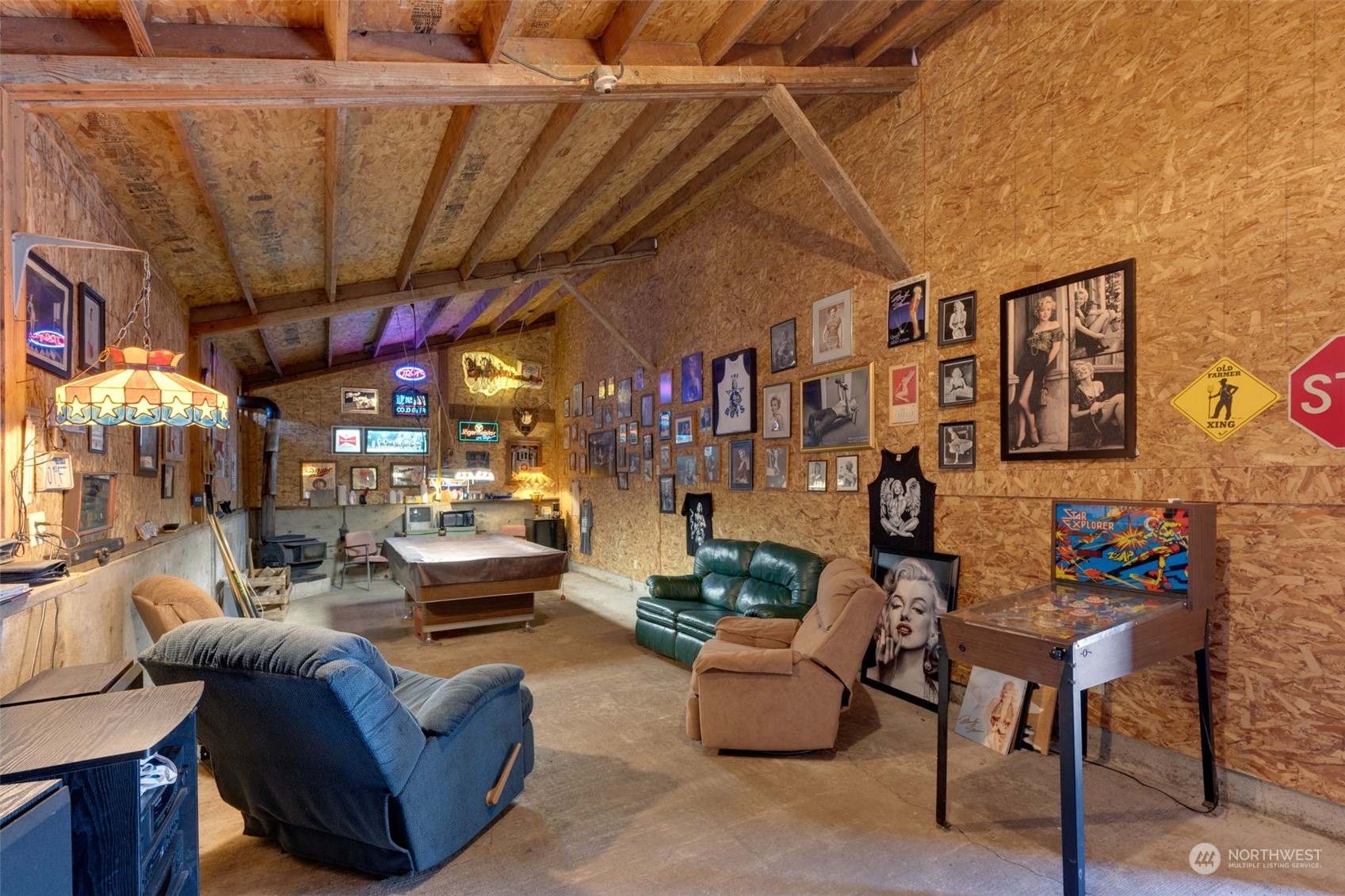 628 East Valley Road Skamokawa, WA 98647 - Photo 14 of 39 a living room with furniture and a chandelier