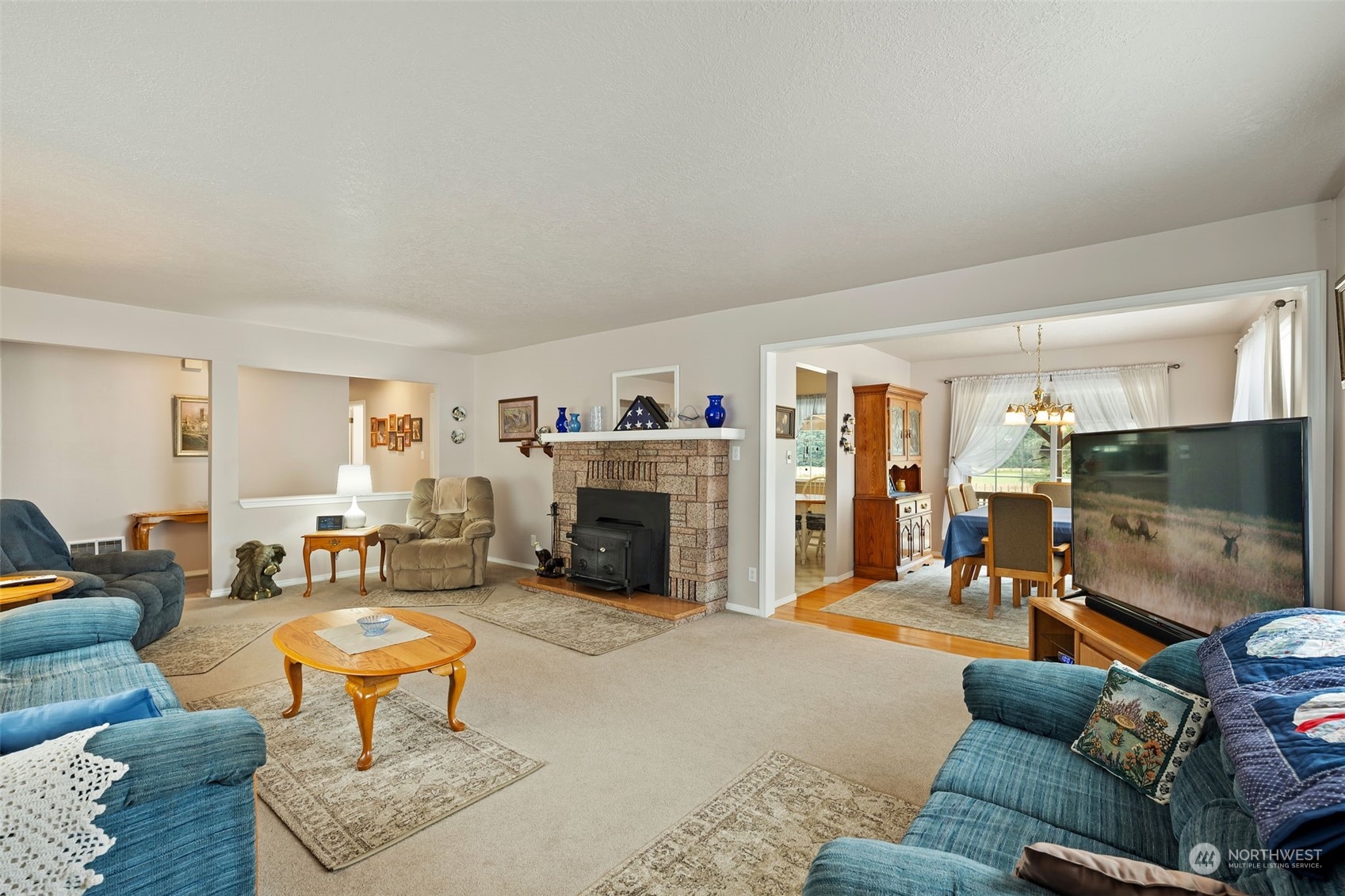628 East Valley Road Skamokawa, WA 98647 - Photo 19 of 39 a living room with furniture and a flat screen tv