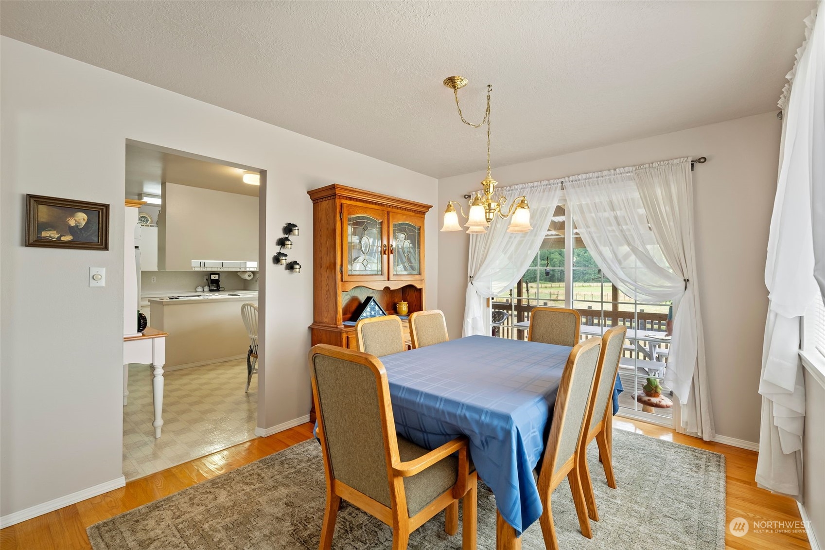 628 East Valley Road Skamokawa, WA 98647 - Photo 20 of 39 a view of a dining room with furniture window and wooden floor