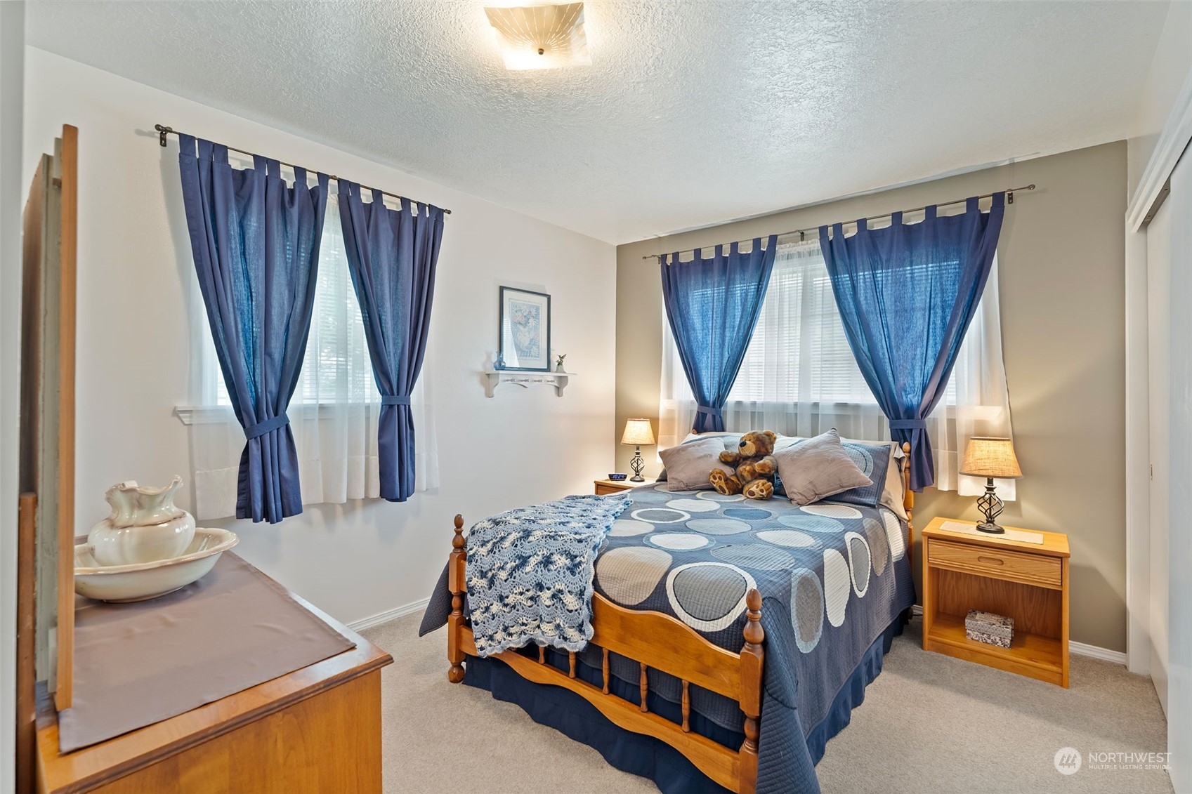 628 East Valley Road Skamokawa, WA 98647 - Photo 27 of 39 a bedroom with a bed and a dresser