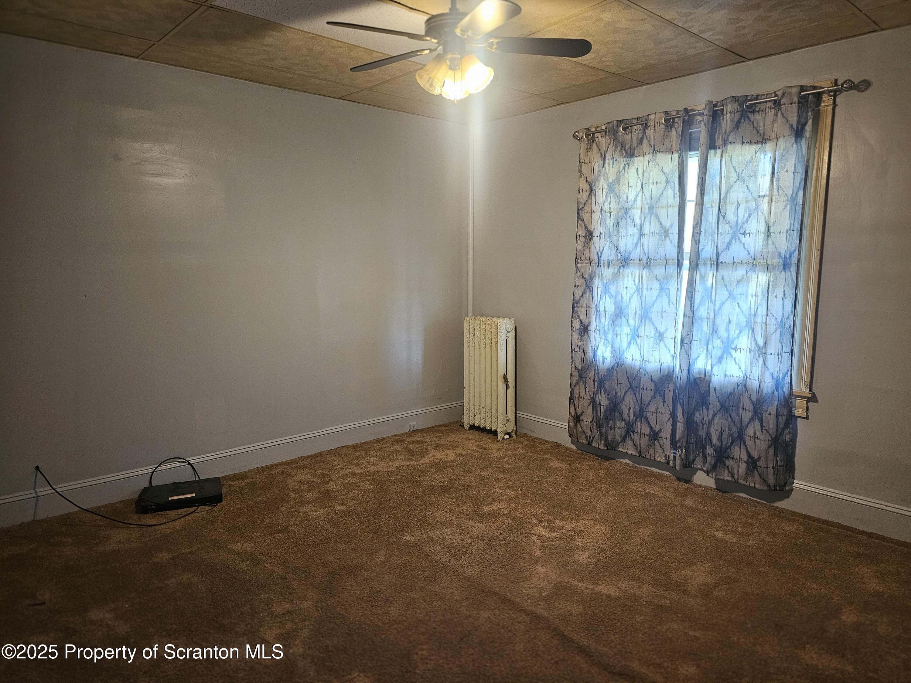 510 Front Street, Unit 1E Scranton, PA 18505 - Photo 4 of 5 a view of an empty room with a window