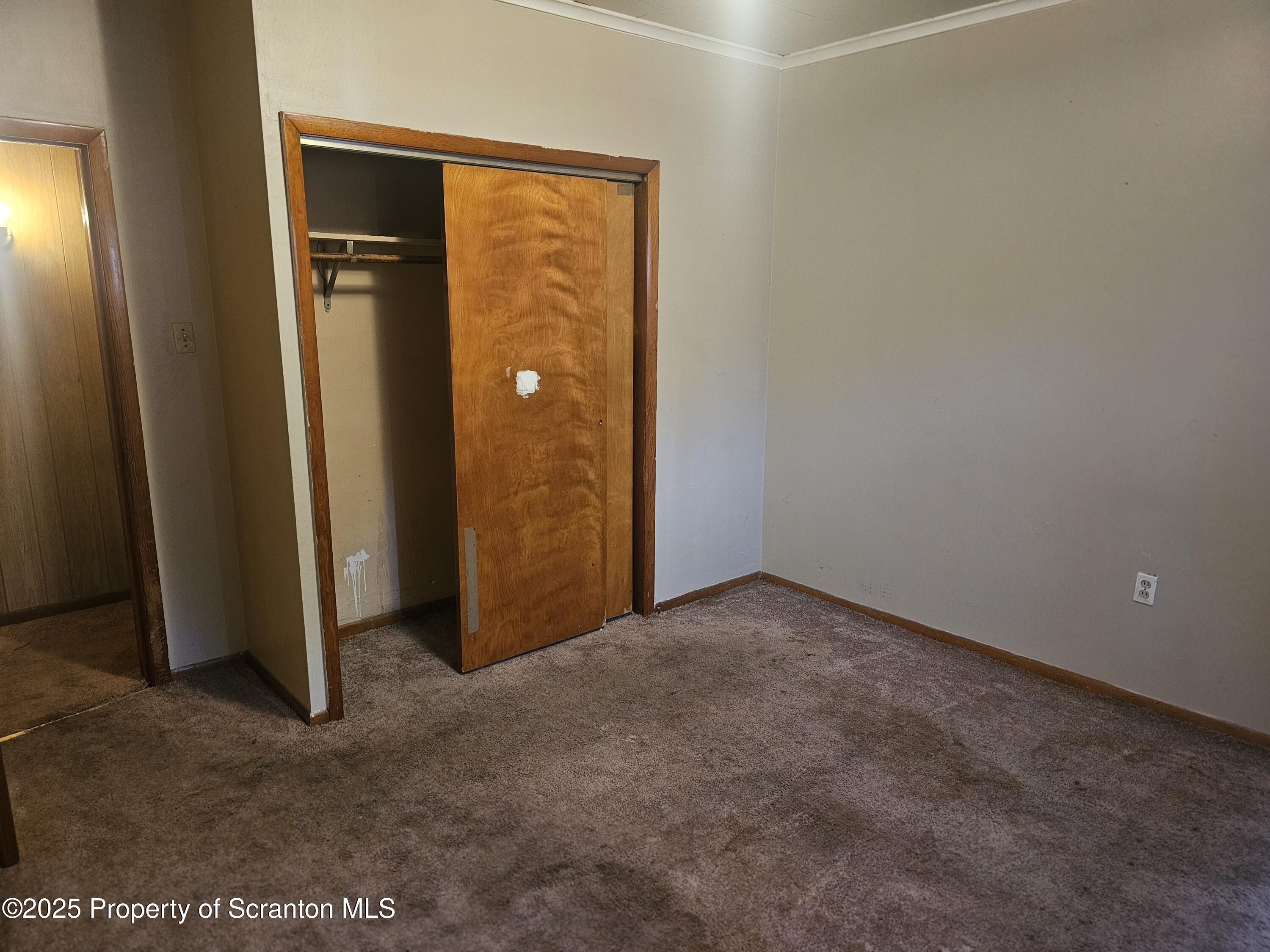 510 Front Street, Unit 1E Scranton, PA 18505 - Photo 5 of 5 an empty room with closet area