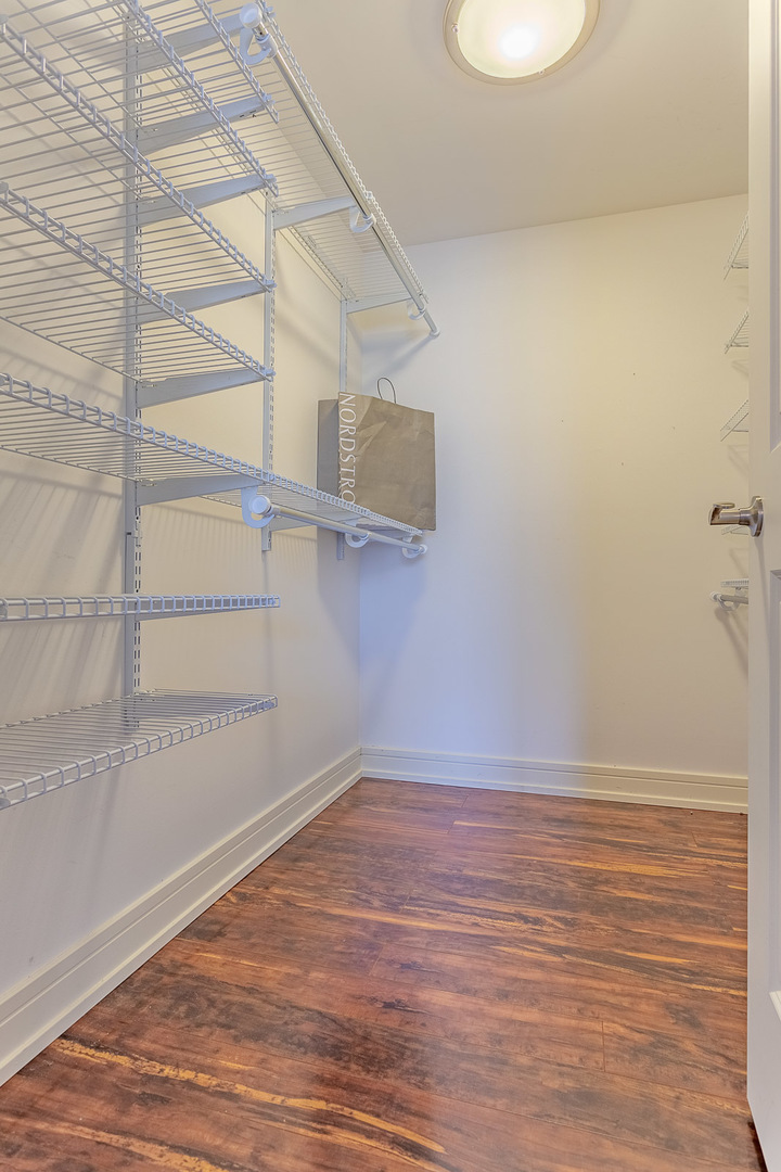 1615 East Central Road, Unit 401A Arlington Heights, IL 60005 - Photo 12 of 18 a view of a room with wooden floor and small space