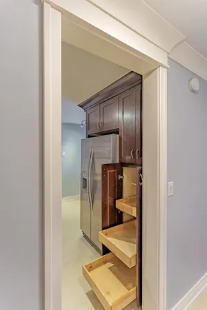 a kitchen with a refrigerator and washer