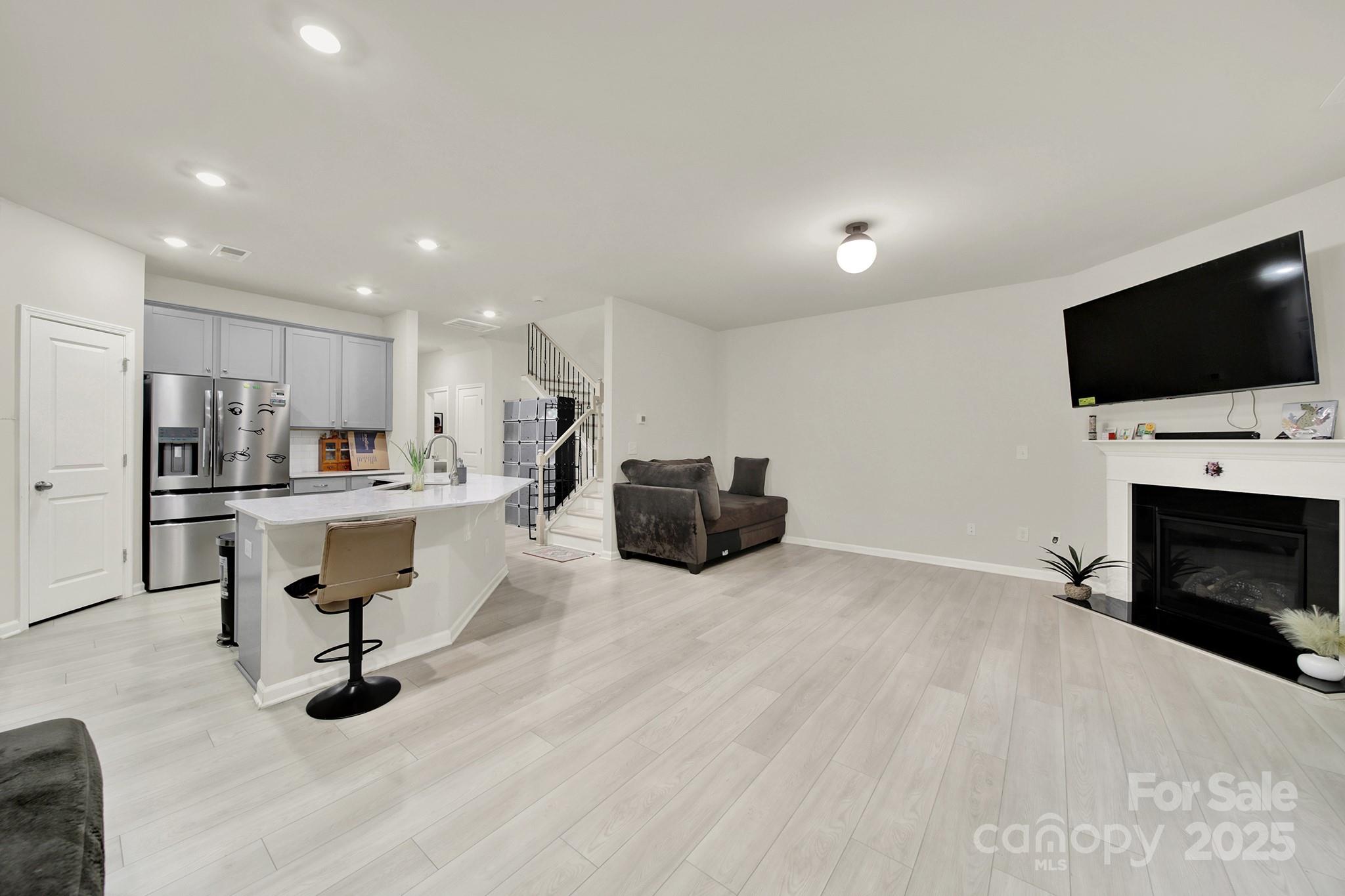 6009 Chelsea Oaks Ridge Fort Mill, SC 29708 - Photo 11 of 30 a living room with furniture and a flat screen tv