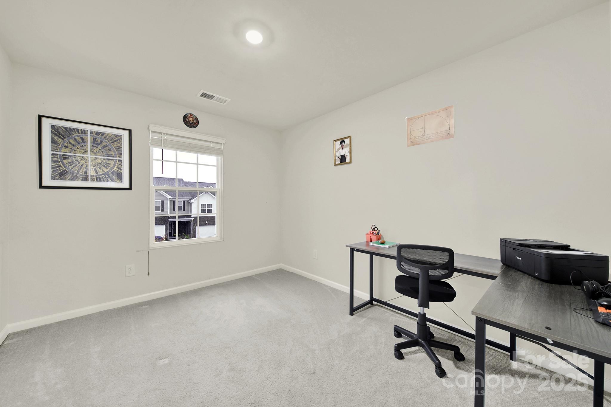 6009 Chelsea Oaks Ridge Fort Mill, SC 29708 - Photo 15 of 30 a view of a workspace with furniture and a window