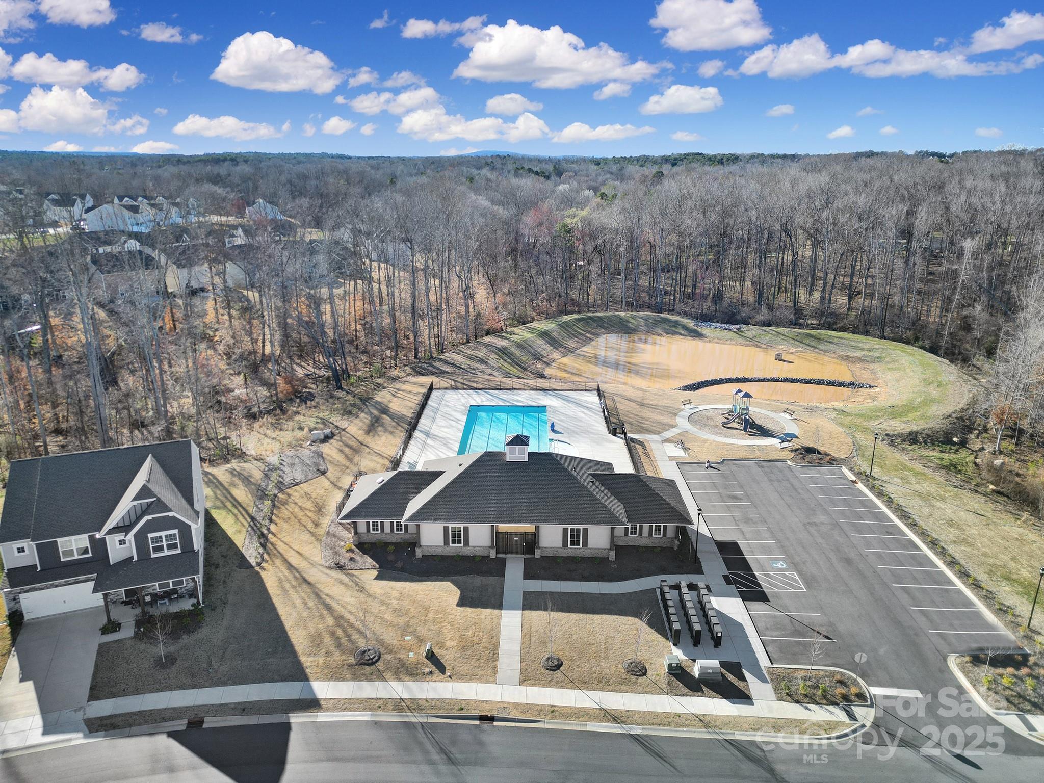 6009 Chelsea Oaks Ridge Fort Mill, SC 29708 - Photo 28 of 30 a view of a swimming pool with a patio