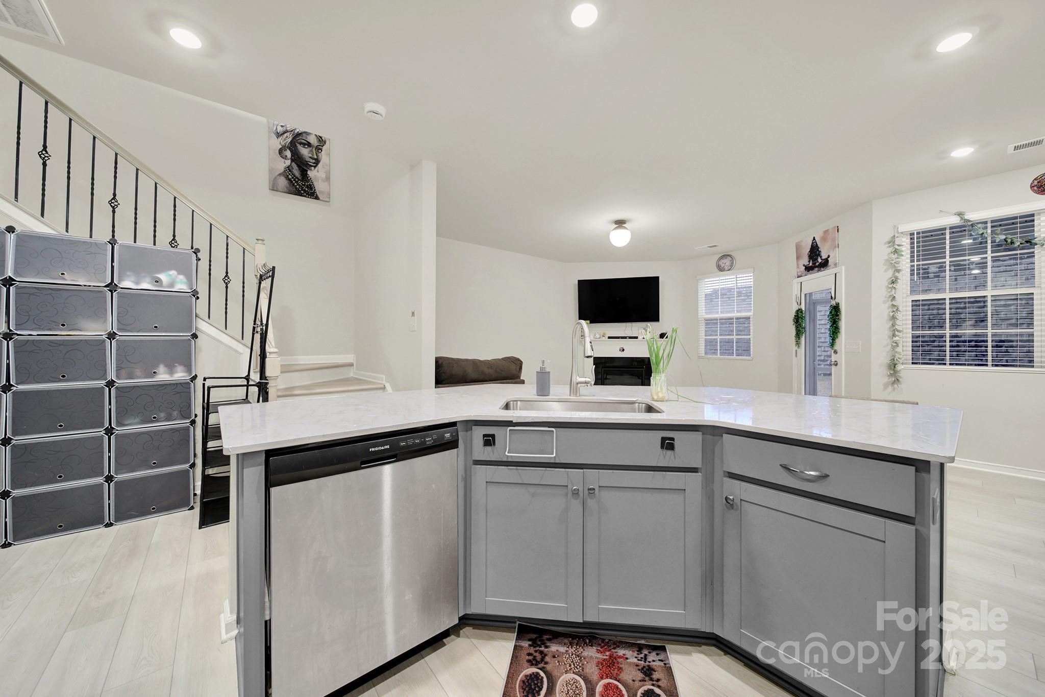 6009 Chelsea Oaks Ridge Fort Mill, SC 29708 - Photo 6 of 30 a kitchen with stainless steel appliances a sink and cabinets