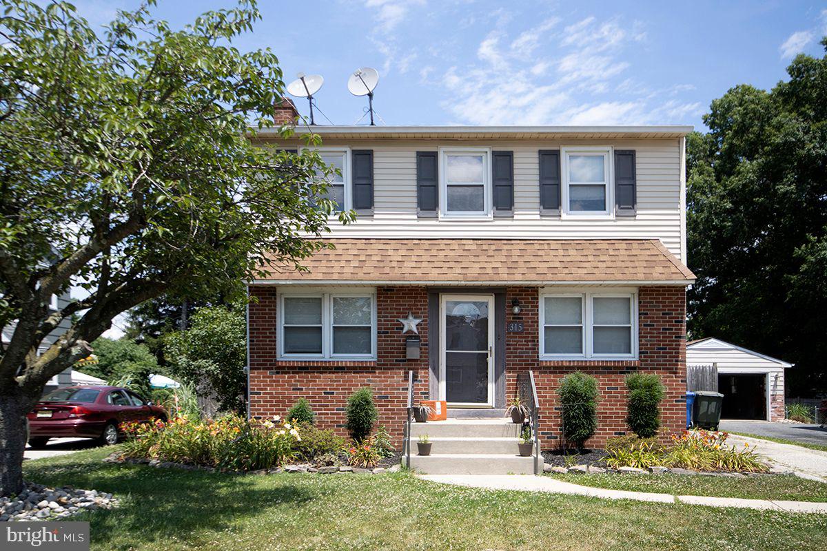 315 Cornell Road Glassboro, NJ 08028 - Photo 1 of 22 a front view of a house with a yard and outdoor seating