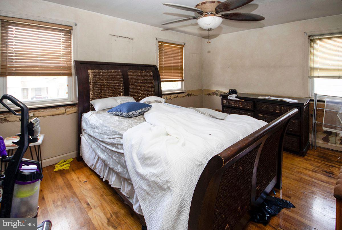 315 Cornell Road Glassboro, NJ 08028 - Photo 15 of 22 a bedroom with a bed and wooden floor