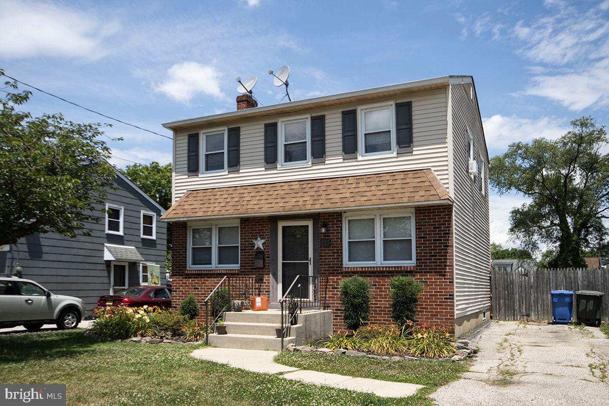 315 Cornell Road Glassboro, NJ 08028 - Photo 2 of 22 a front view of a house with a yard