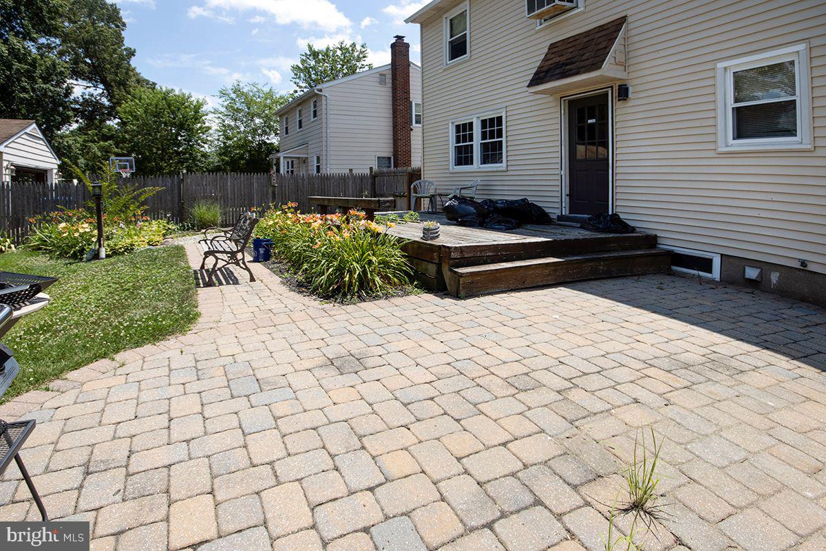 315 Cornell Road Glassboro, NJ 08028 - Photo 8 of 22 a view of a backyard with plants and a chair