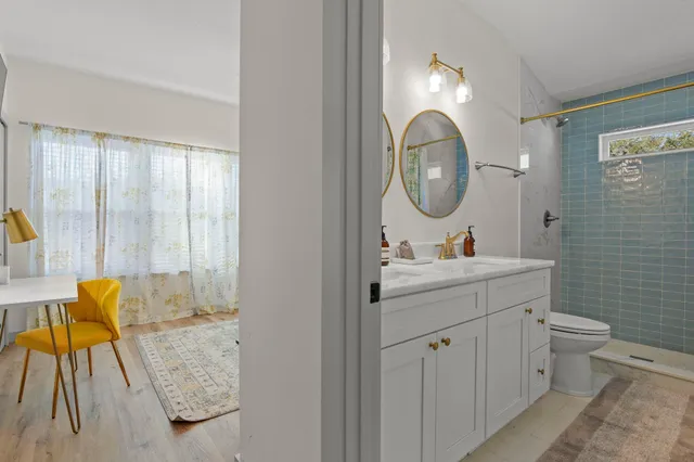 a bedroom with a bed and a couch