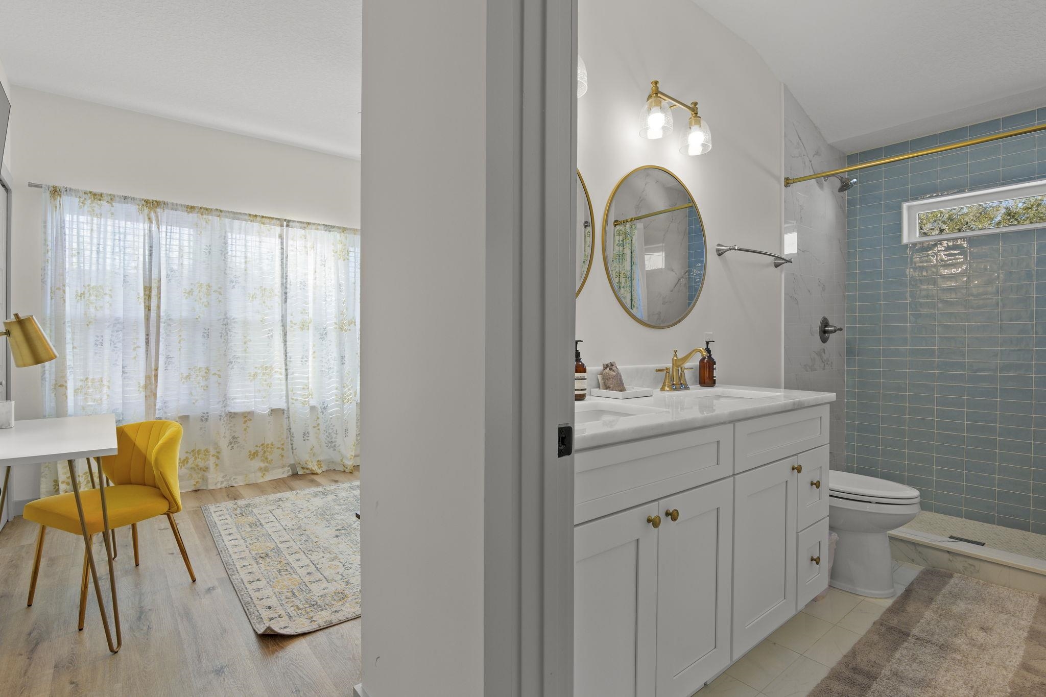 110 Moore Street St. Augustine, FL 32084 - Photo 12 of 39 a bathroom with a toilet sink and mirror