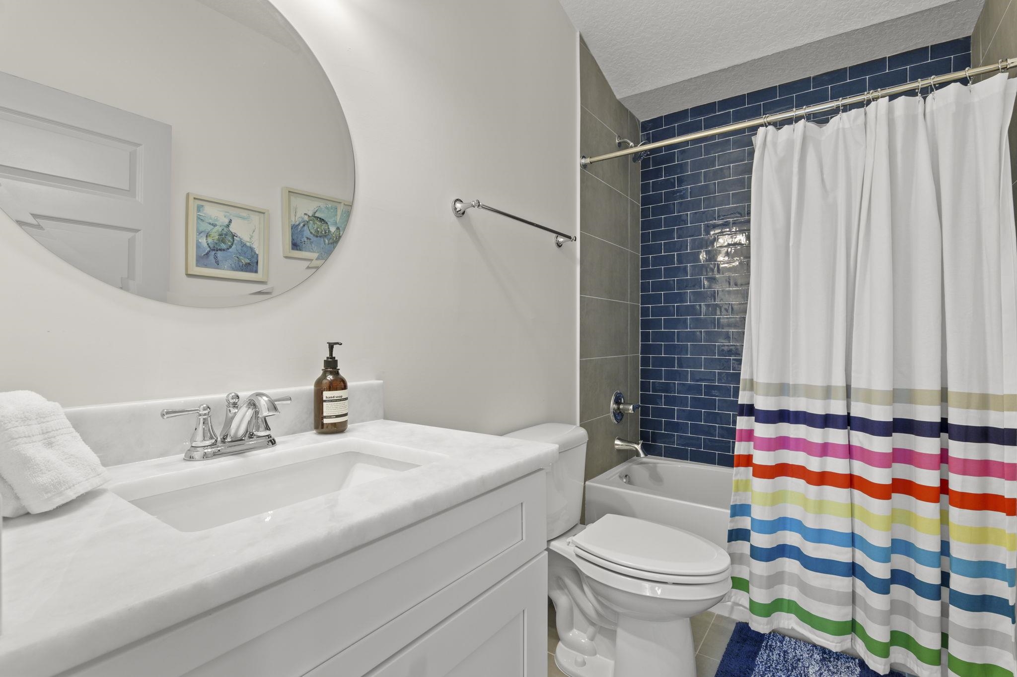 110 Moore Street St. Augustine, FL 32084 - Photo 16 of 39 a bathroom with a sink toilet and shower