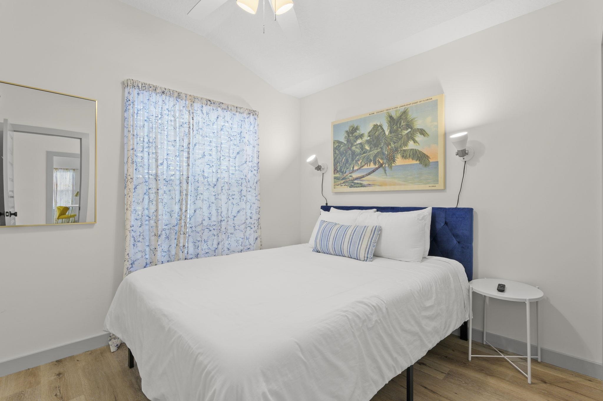 110 Moore Street St. Augustine, FL 32084 - Photo 18 of 39 a large bed sitting in a bedroom next to a window