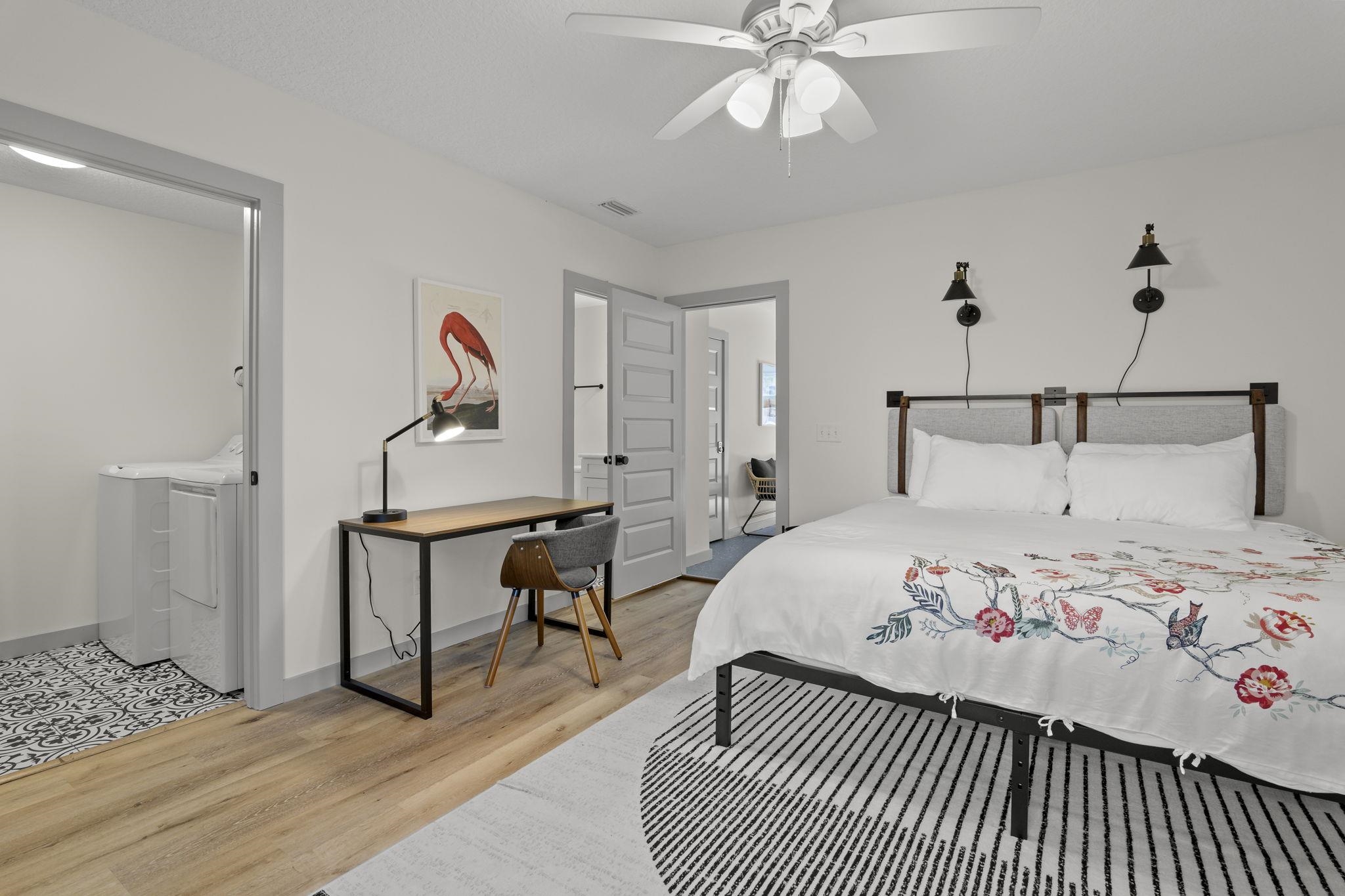 110 Moore Street St. Augustine, FL 32084 - Photo 20 of 39 a bedroom with a bed and wooden floor