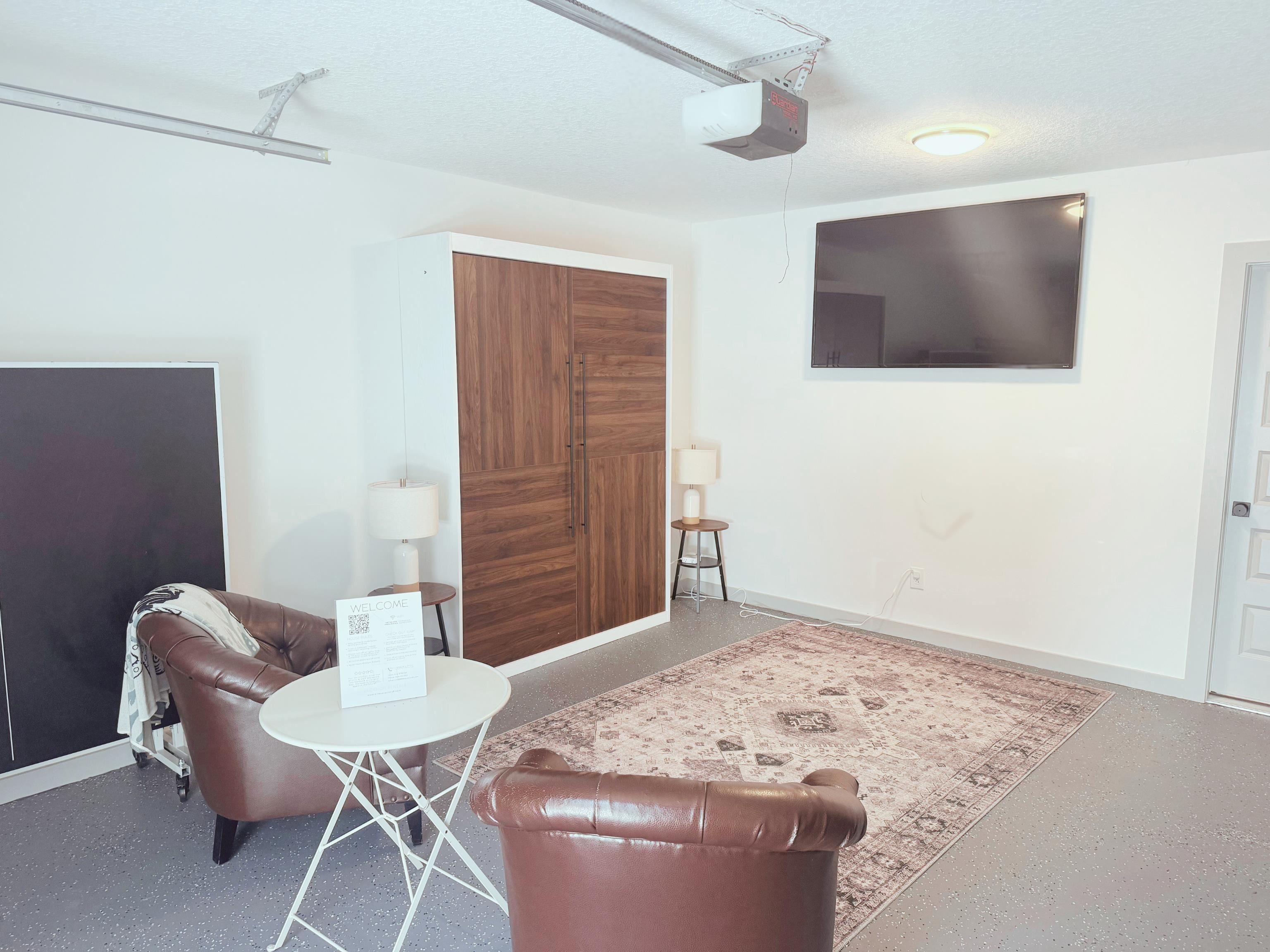 110 Moore Street St. Augustine, FL 32084 - Photo 23 of 39 a living room with furniture and a flat screen tv
