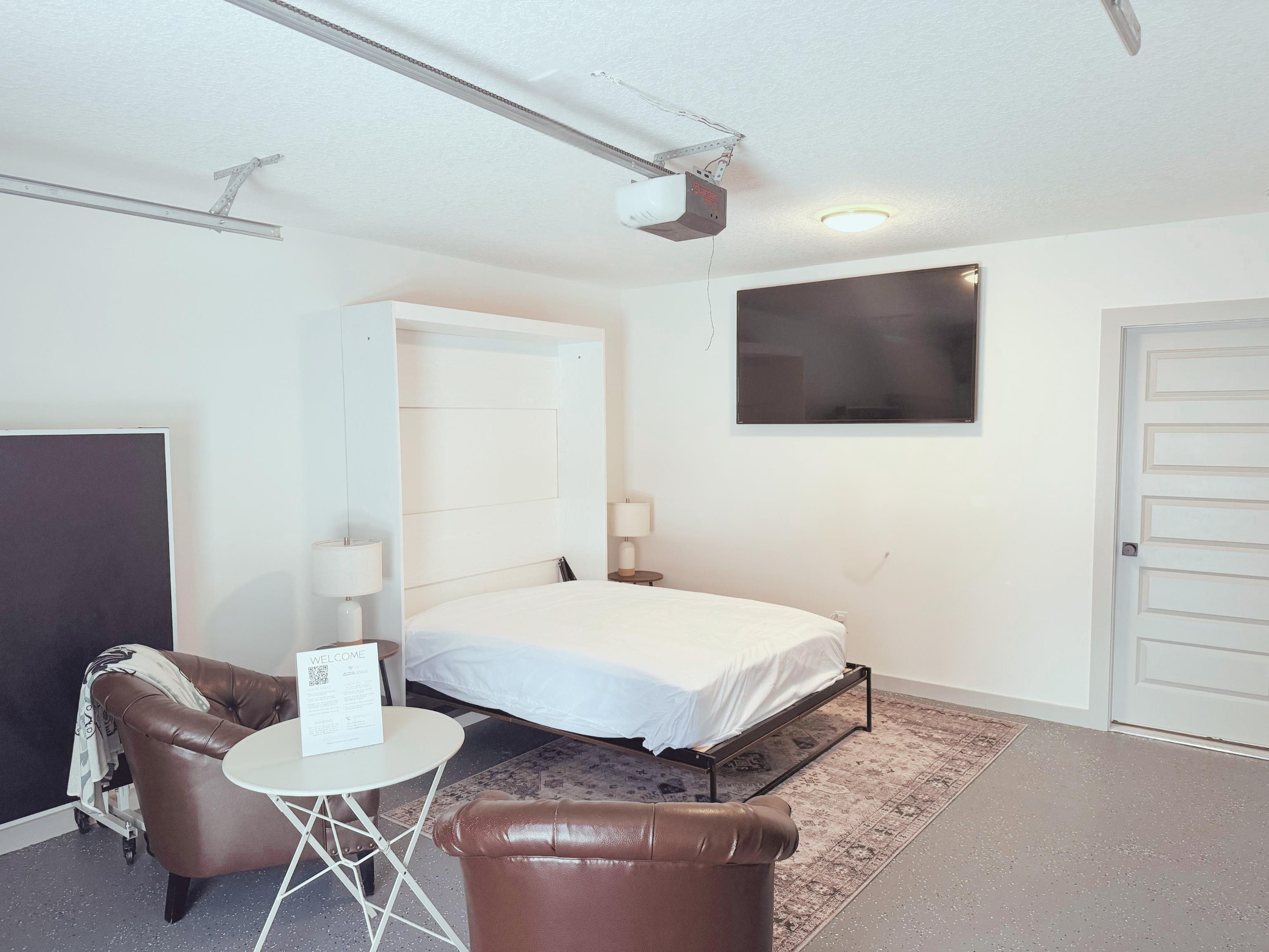 110 Moore Street St. Augustine, FL 32084 - Photo 24 of 39 a bedroom with a bed and a flat screen tv