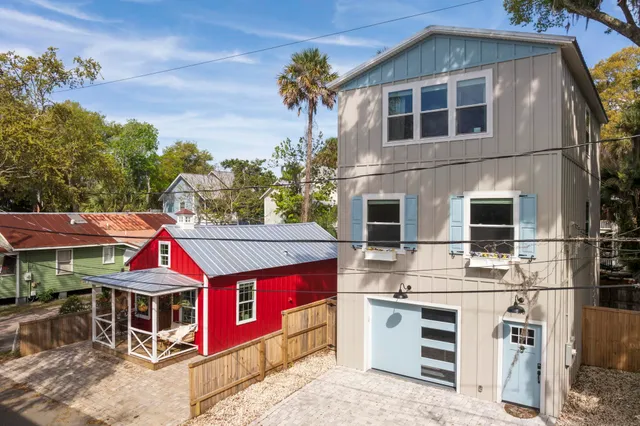 a large kitchen with cabinets wooden floor and stainless steel appliances