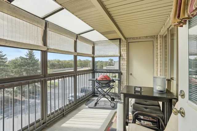 a view of a balcony with wooden floor