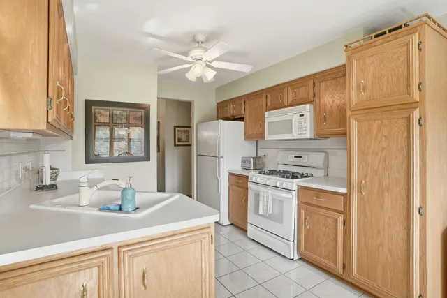 a kitchen with stainless steel appliances granite countertop a stove and a refrigerator