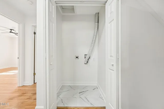 a white bath tub sitting next to a window