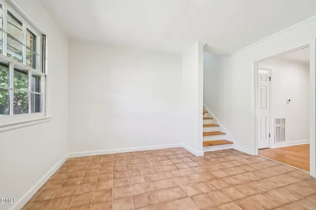 a kitchen with a sink cabinets and window