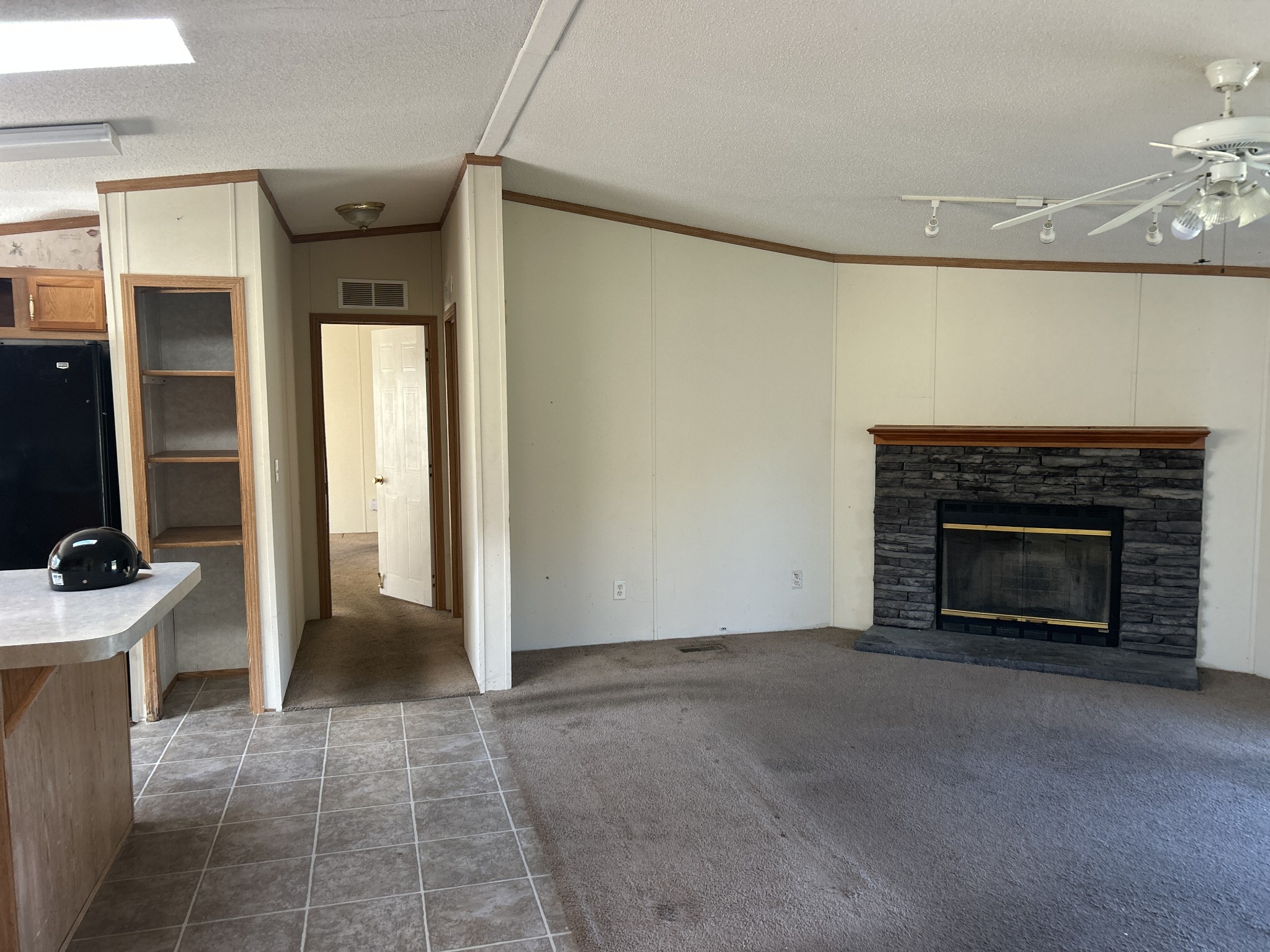 784 Garrison Road Hohenwald, TN 38462 - Photo 11 of 36 a view of an empty room with a fireplace
