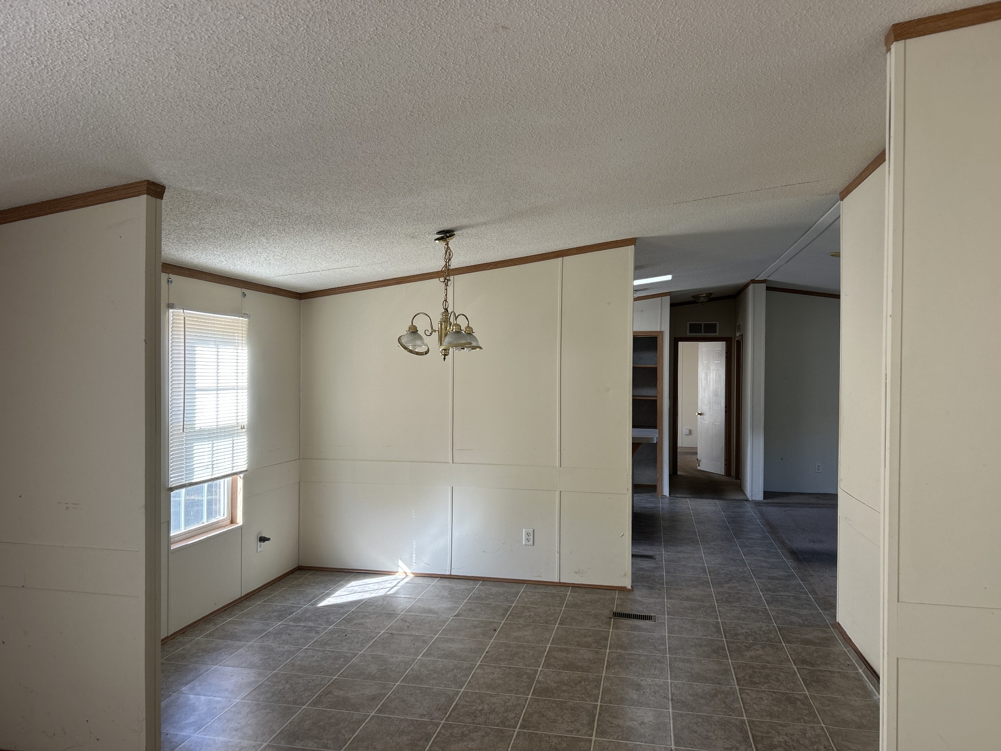 784 Garrison Road Hohenwald, TN 38462 - Photo 13 of 36 a view of an empty room with window and closet area