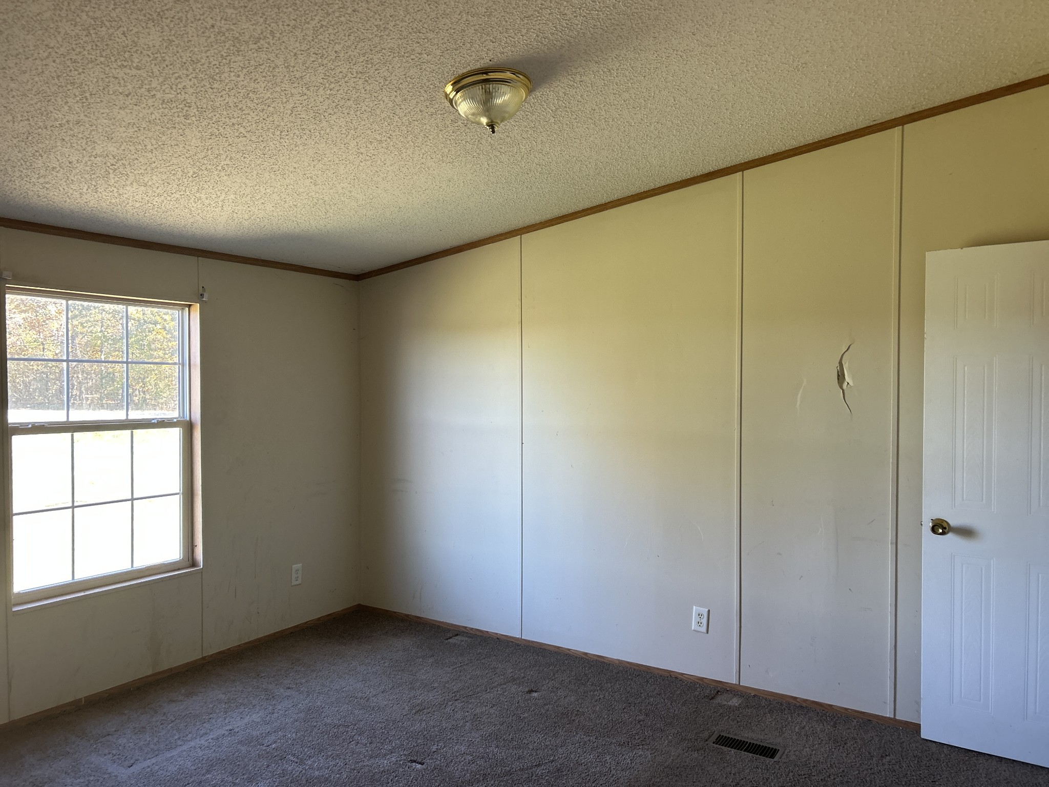 784 Garrison Road Hohenwald, TN 38462 - Photo 14 of 36 an empty room with a empty space and windows