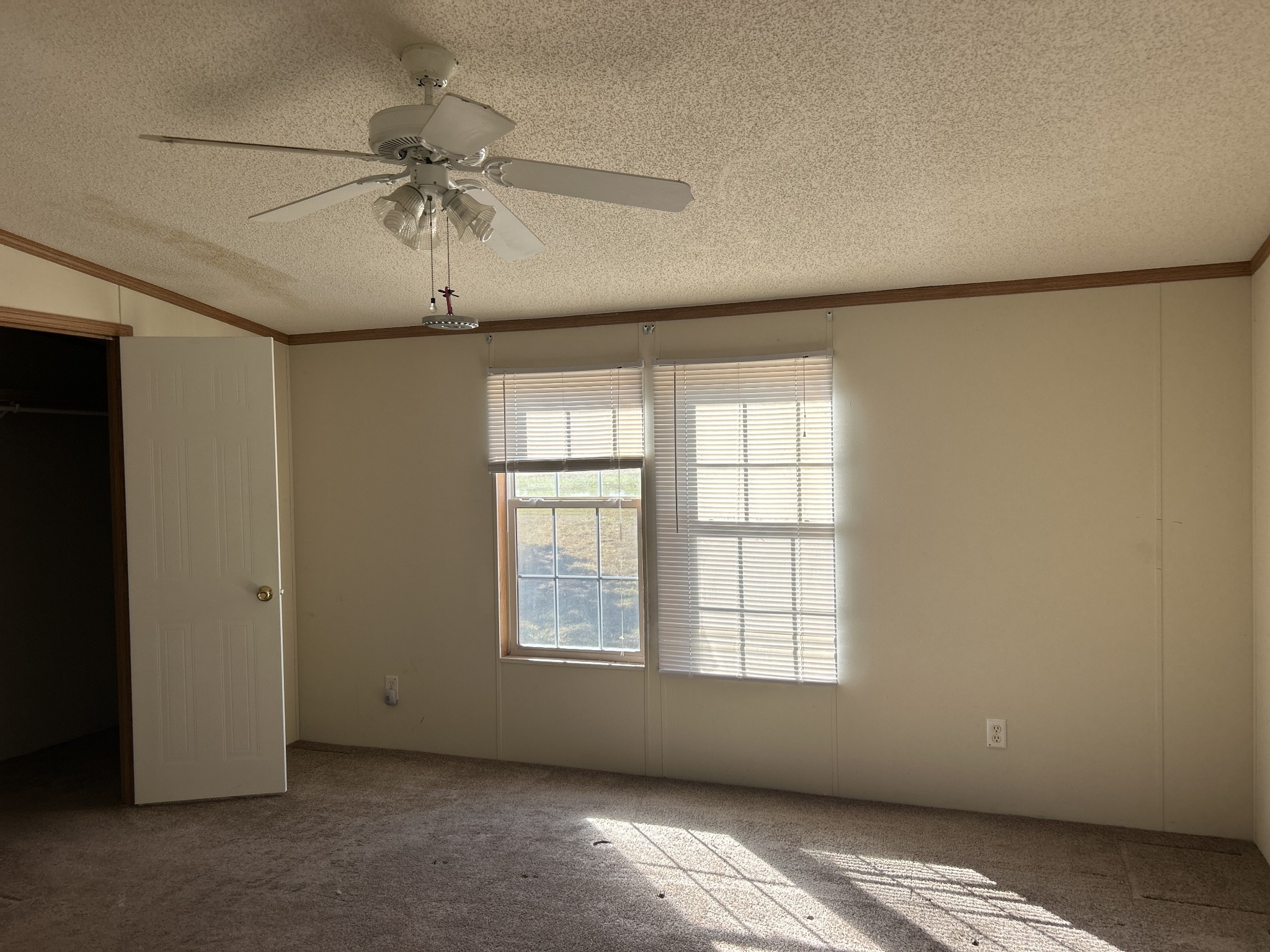 784 Garrison Road Hohenwald, TN 38462 - Photo 22 of 36 a view of room with a ceiling fan and window